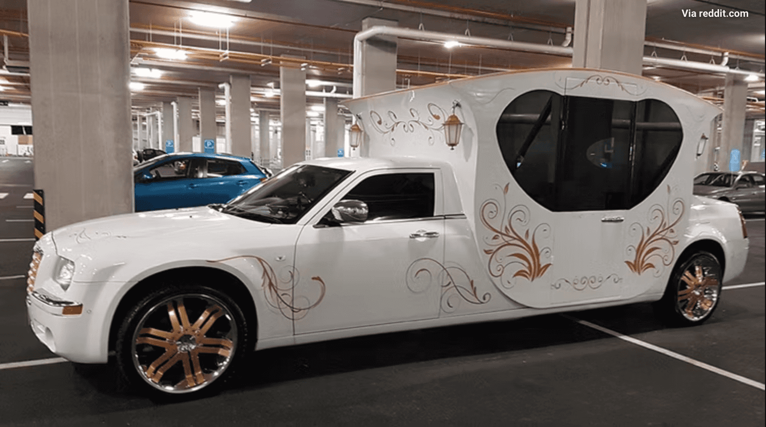 A costum built car that is white with gold details